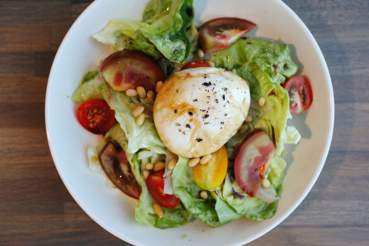 Burrata salad with tomatoes and greens at Amici